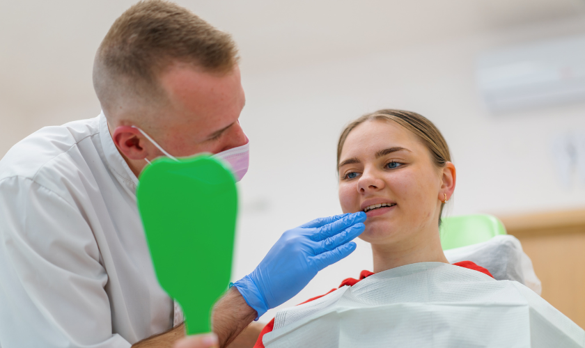 Patient learning proper oral hygiene habits during a dental visit in Manhattan NYC